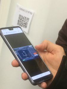 Students play BEACONING on smart phones in Library building